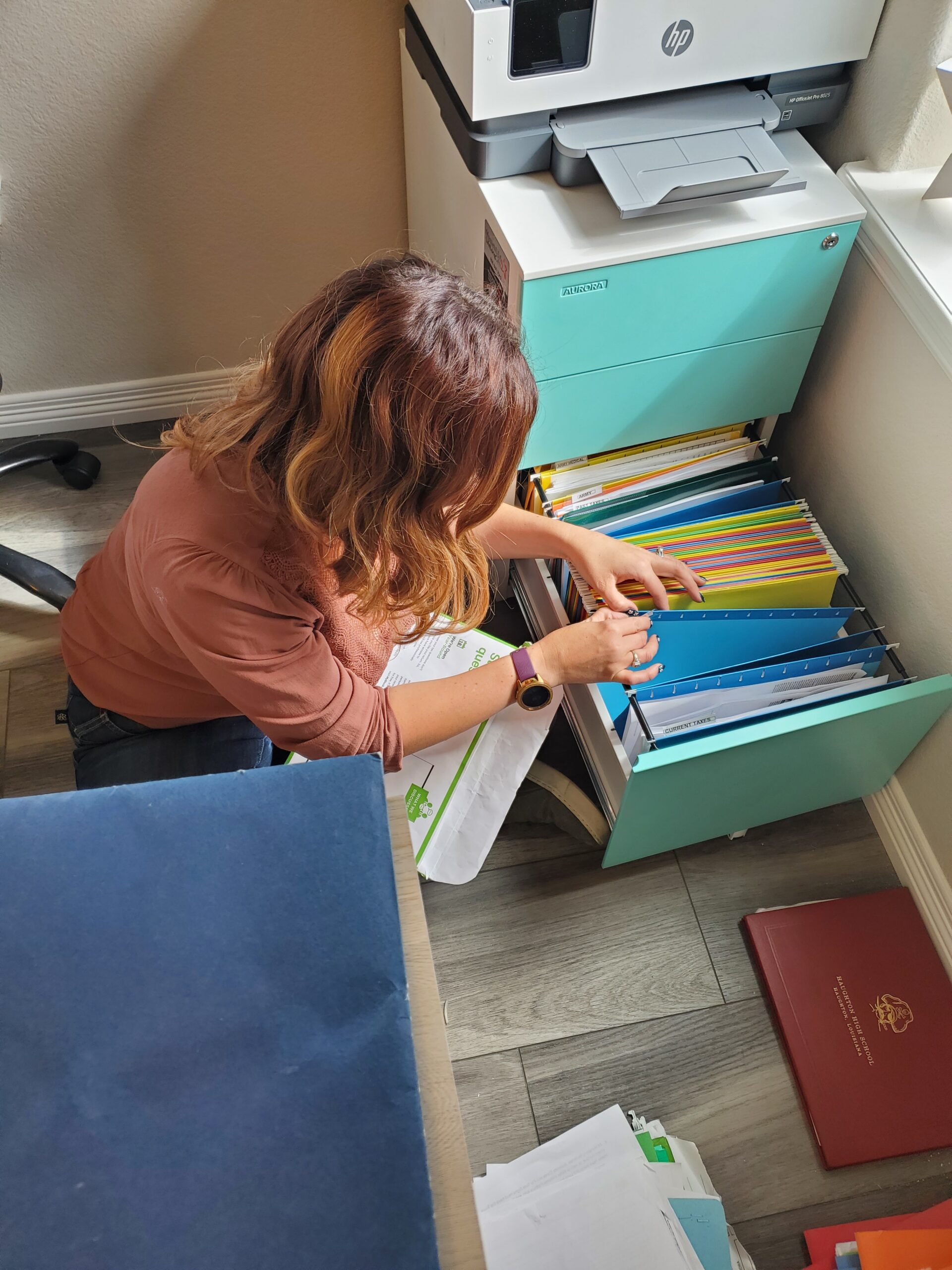 Lauren Klayton organizing a home filing system in Colorado Springs
